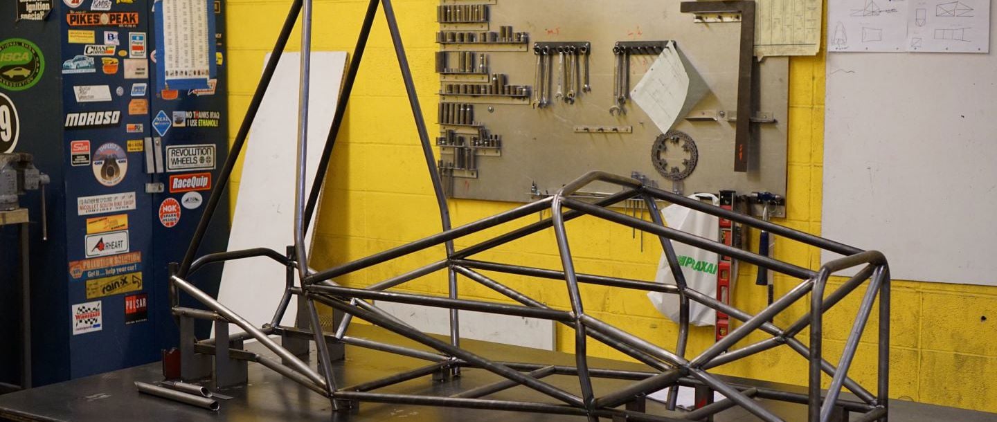 a formula SAE chasis on a table in the Automotive Dyno Lab