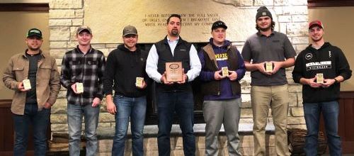 Construction Management students and faculty mentor posing with awards at the 2019 Associated Schools of Construction Region 4 competition