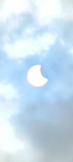 a partial solar eclipse in the sky