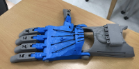 3D Printed Prosthetic Arm on a table