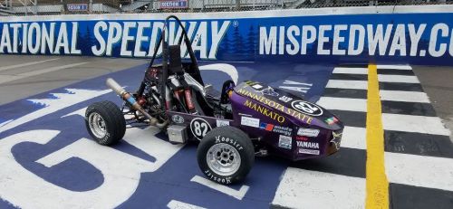 The Minnesota State University Mankato formula-style racing car parked on the racing track 