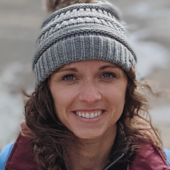 Alli Krynski posing in her graduation gown