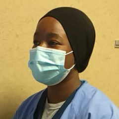 Halimat Abdulganiyu posing in her graduation gown