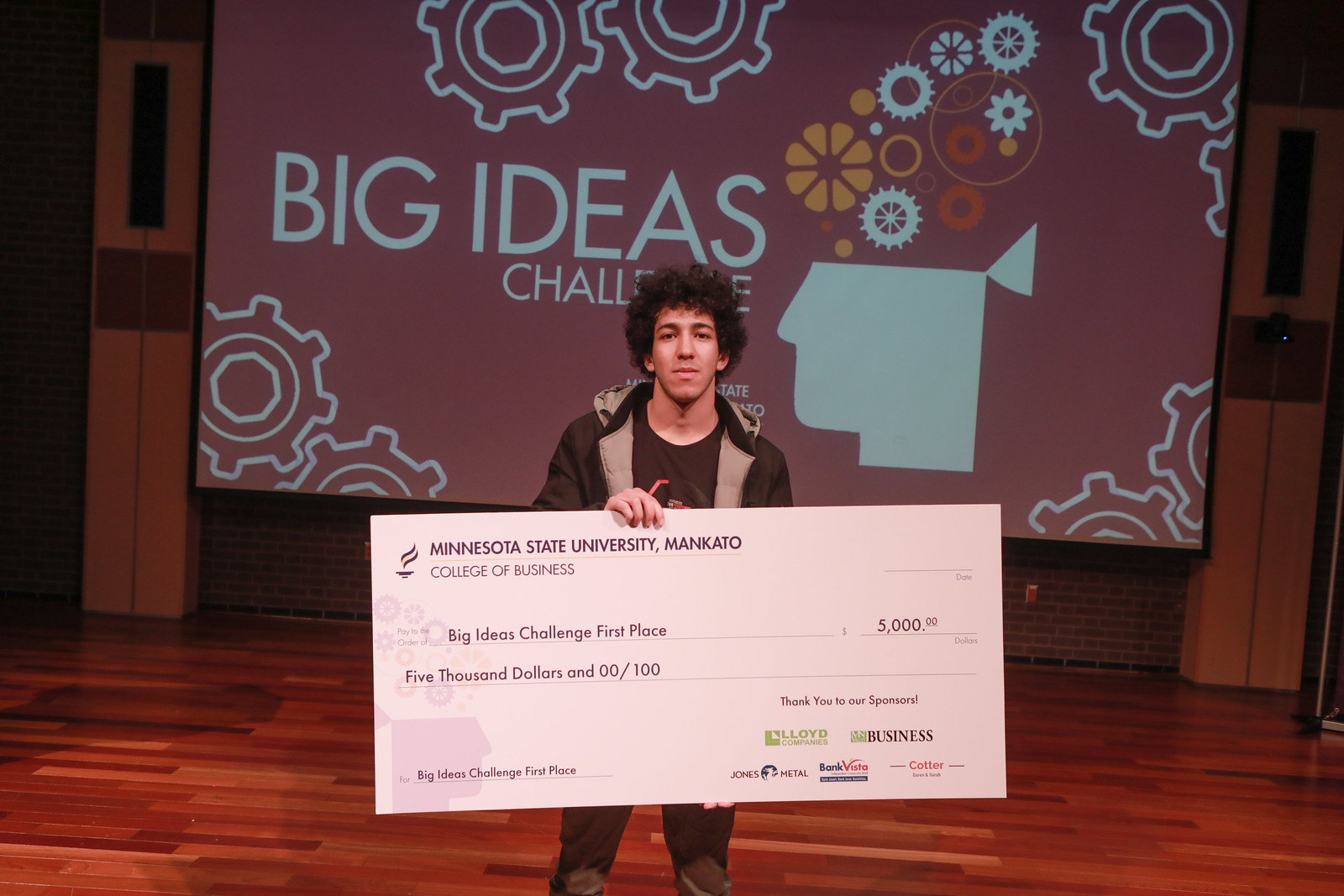 Omar Elkenawy posing with his Big Ideas Challenge award