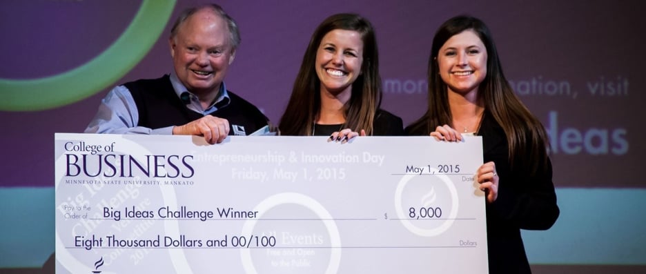 The 2015 Big Ideas Challenge winners, Mankato Pediatric Respite, posing with the giant check they won from the College of Business
