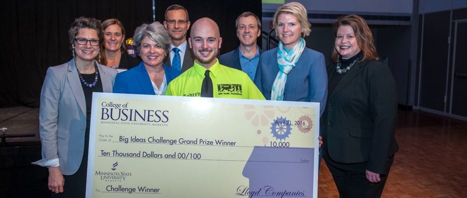 The 2016 Big Ideas Challenge winners, Iron Range Maker Space - Andrew Hangemon, posing with the giant check they won from the College of Business