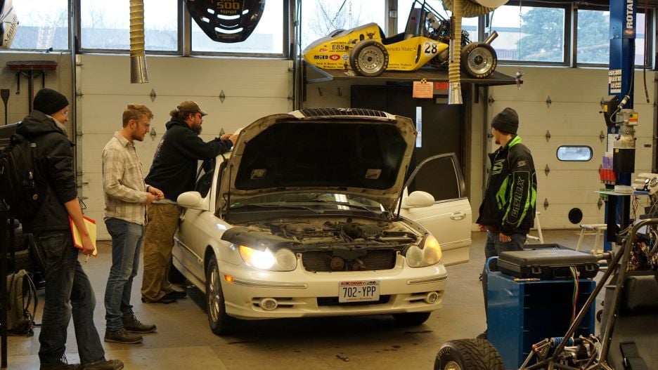 Students working on a car in the AET Lab