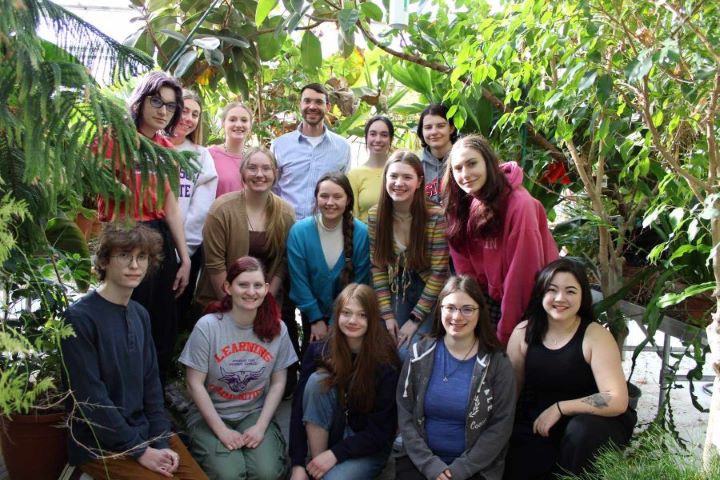 a group of people posing for a photo