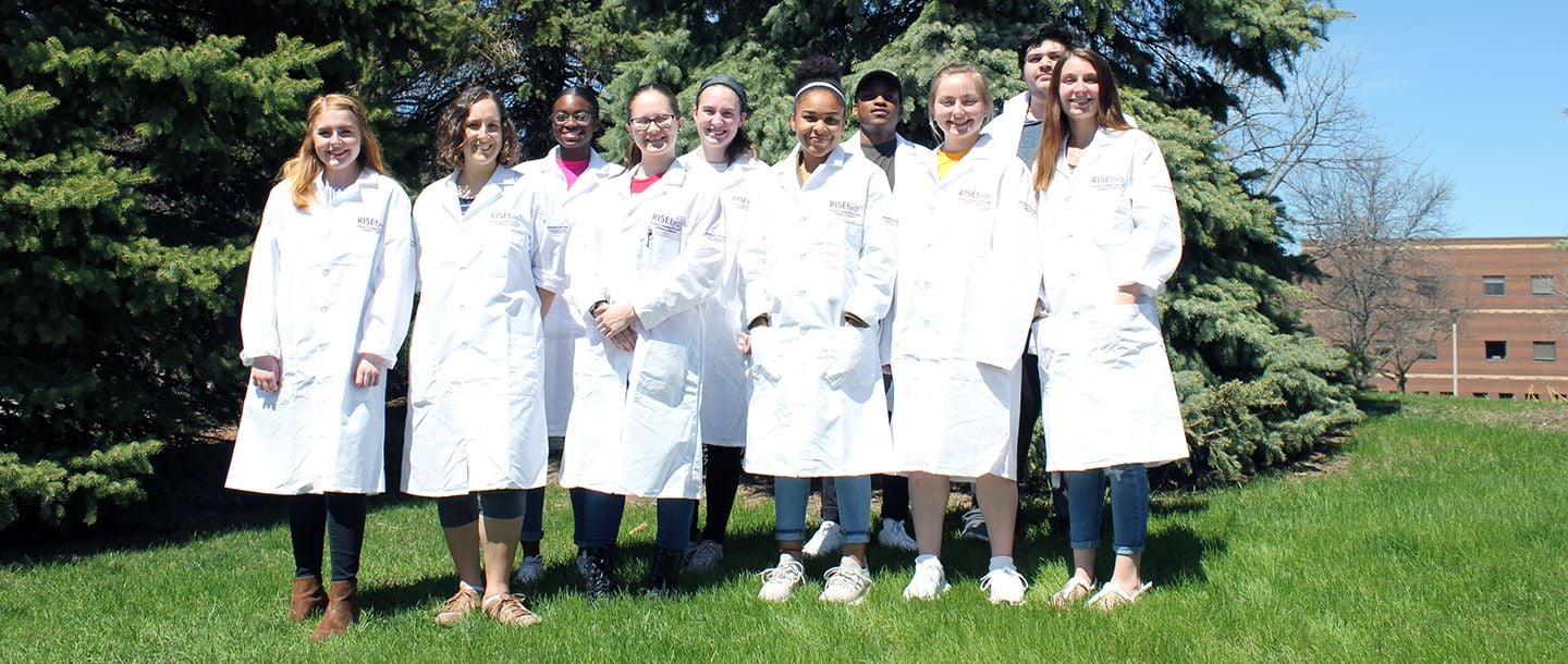 Group of the Biological Sciences students posing outside on campus