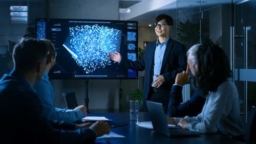 Partners at an office table during a project meeting