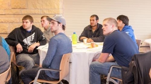 Construction Management students at tables during a 2010 event