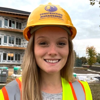 Hailey Schwieger posing at construction site