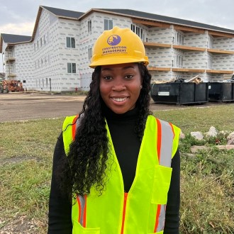 Cindy Wuddah posing at construction site
