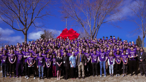 a huge 'You Belong' group photo of student organizations posing outside on campus
