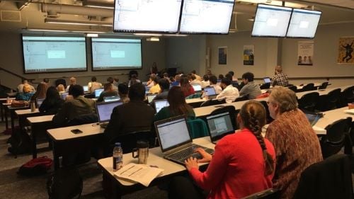 People on computers in a classroom during a SAS training workshop