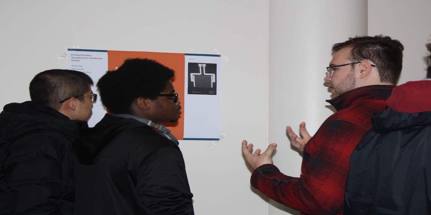 3 students discussing among themselves