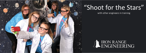 Students posing in lab coats for a selfie with the text "Shoot for the Stars" Iron Range Engineering