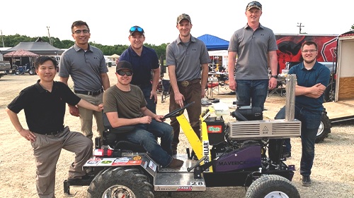 Faculty and students posing by their 2019 ASABE IQS Tractor Student Design Competition