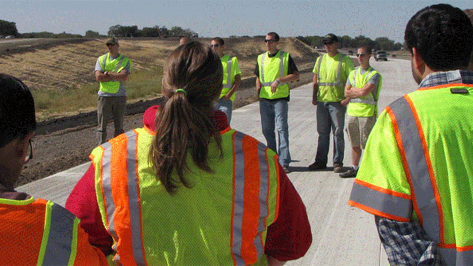 Civil Engineering students outside on a road construction test site