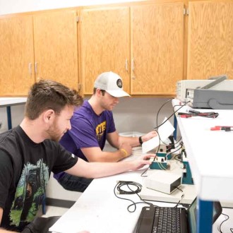 students working in the controls lab