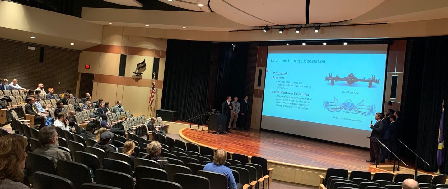 A group of mechanical engineering students doing a presentation on divetrain concept generation in the Centennial Student Union’s Ostrander Auditorium